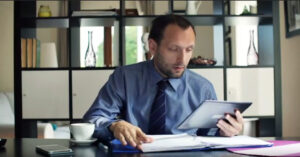 Man looking at his tablet