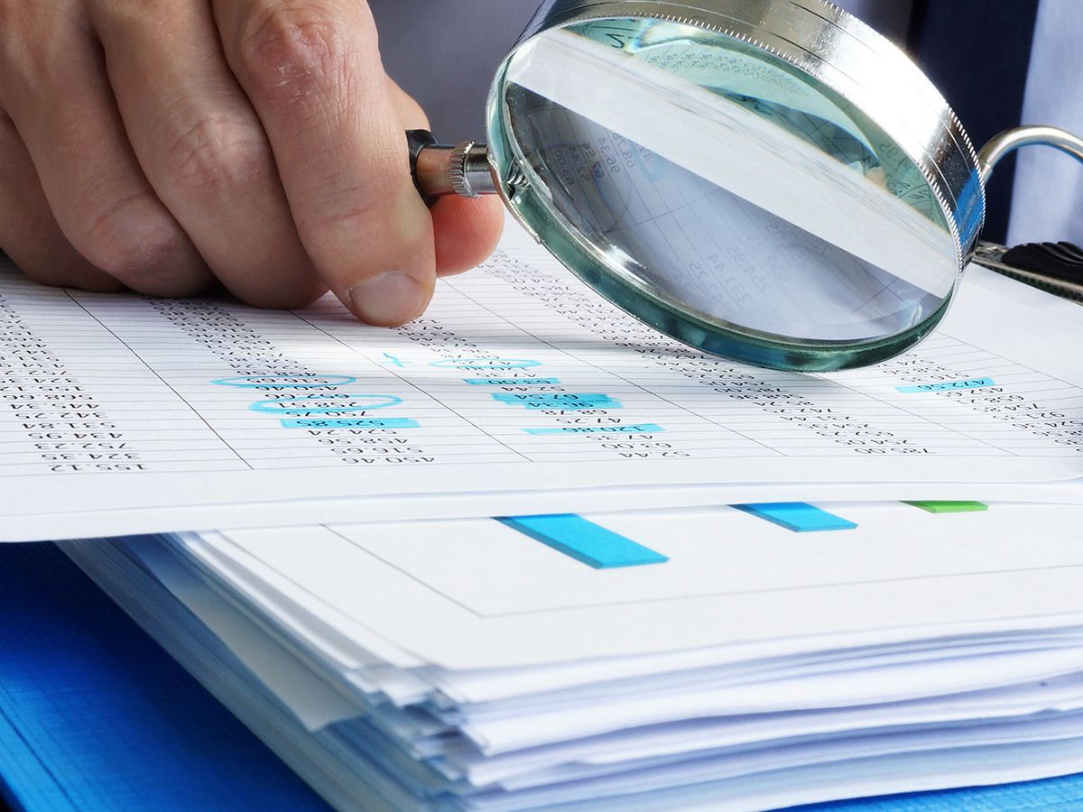 Auditor is working with financial documents.