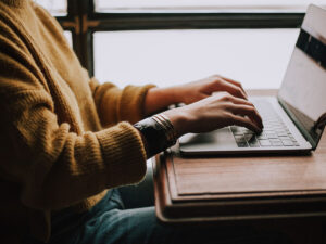 woman typing on computer