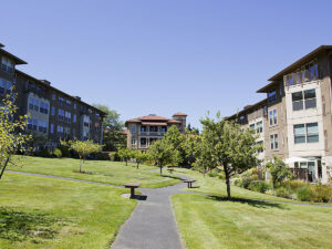 The exterior of a large apartment complex with multiple buildings. 