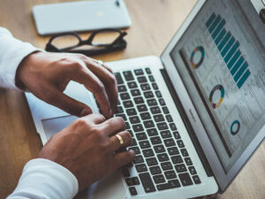 man typing on computer