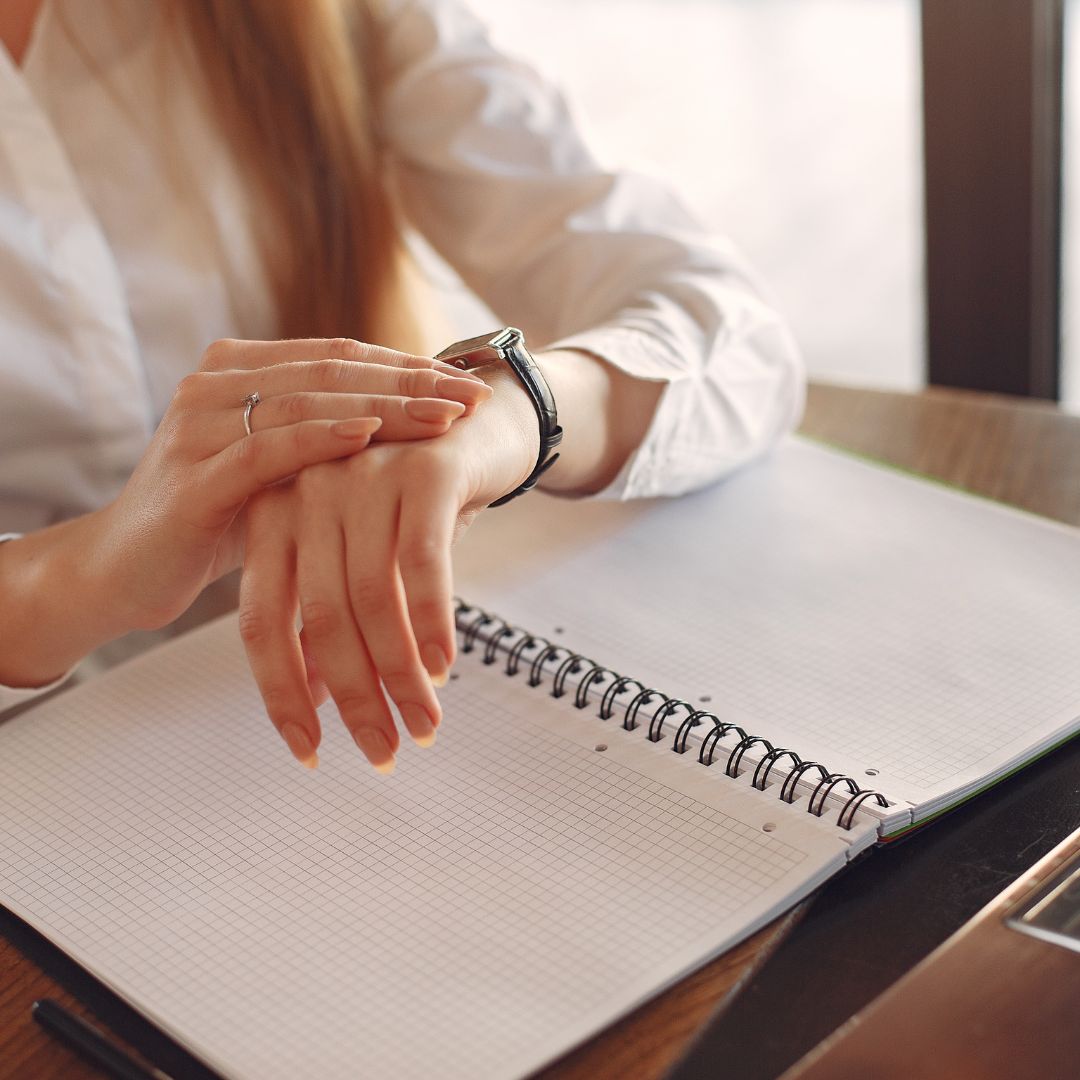woman looking at watch